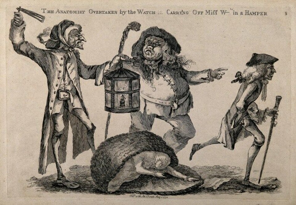 Body-snatchers stjal lik for å tjene på dem. Her forstyrres tyven av en vakt mens oppdragsgiveren, anatomen William Hunter, stikker unna. Gravering av W. Austin, 1773. (Wikimedia Commons) Body-snatchers stjal lik for å tjene på dem. Her forstyrres tyven av en vakt mens oppdragsgiveren, anatomen William Hunter, stikker unna. Gravering av W. Austin, 1773. (Wikimedia Commons)